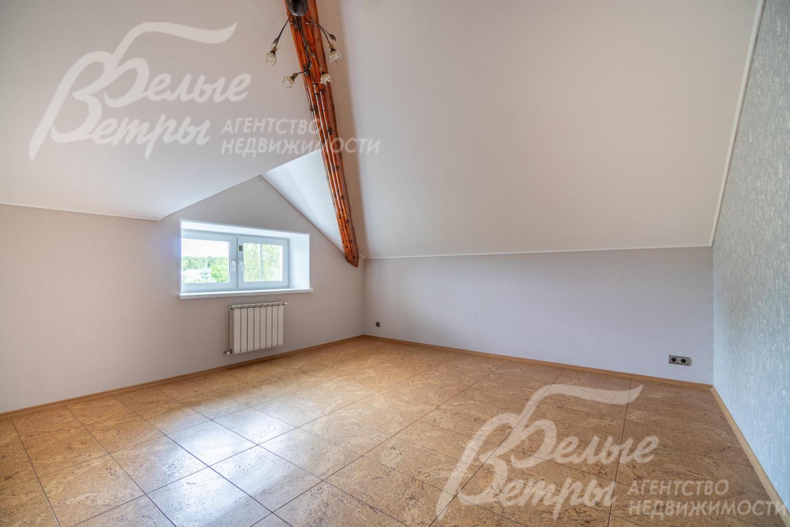 Одна из спален на мансардном этаже